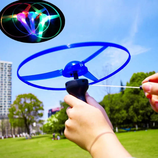 Flying Saucer Toy – LED Pull Line Outdoor Rotating Toy